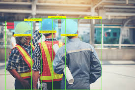 Computer vision AI system detecting PPE compliance with safety equipment recognition overlays on construction workers